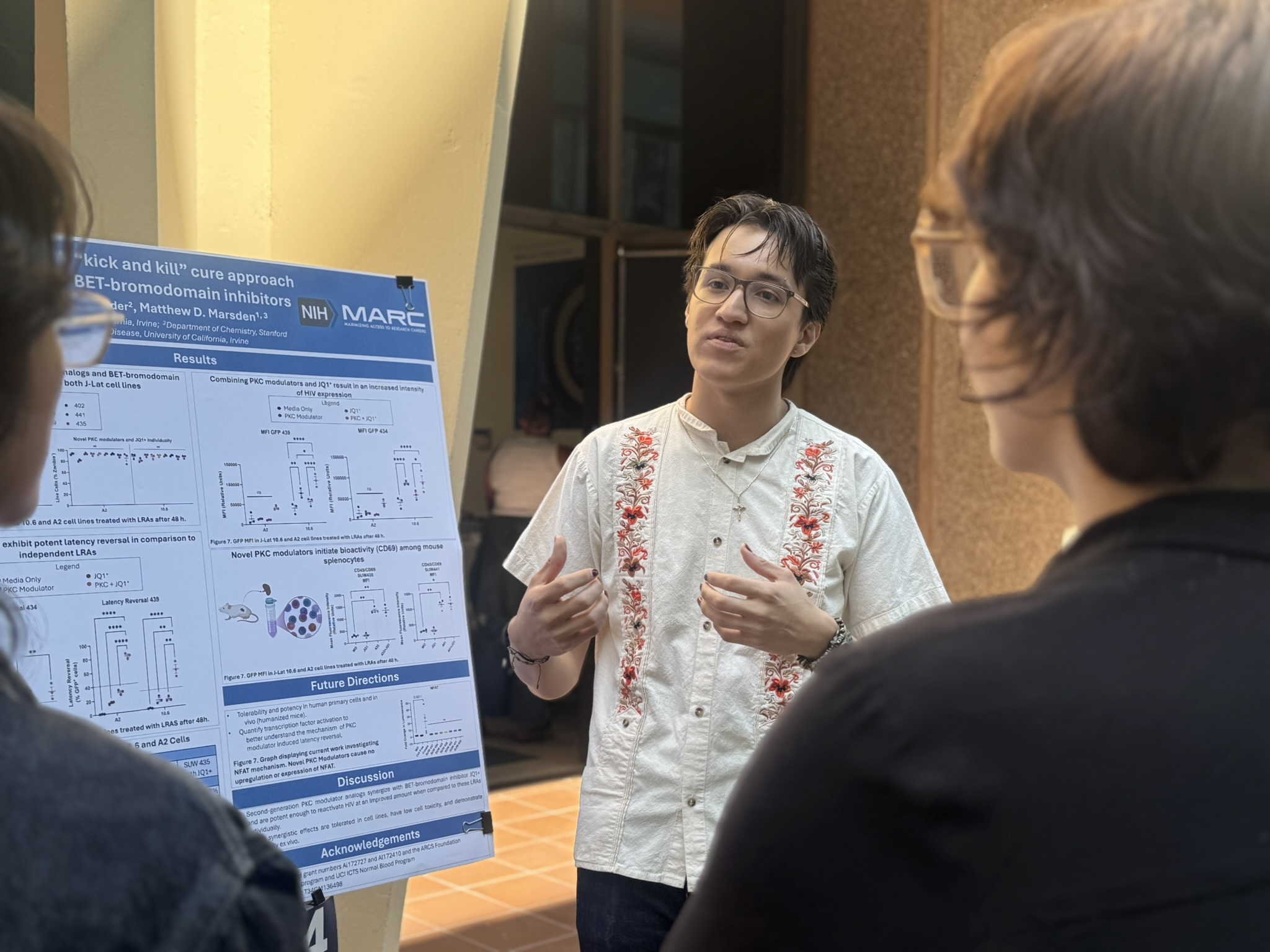 Scholar explaining his research poster