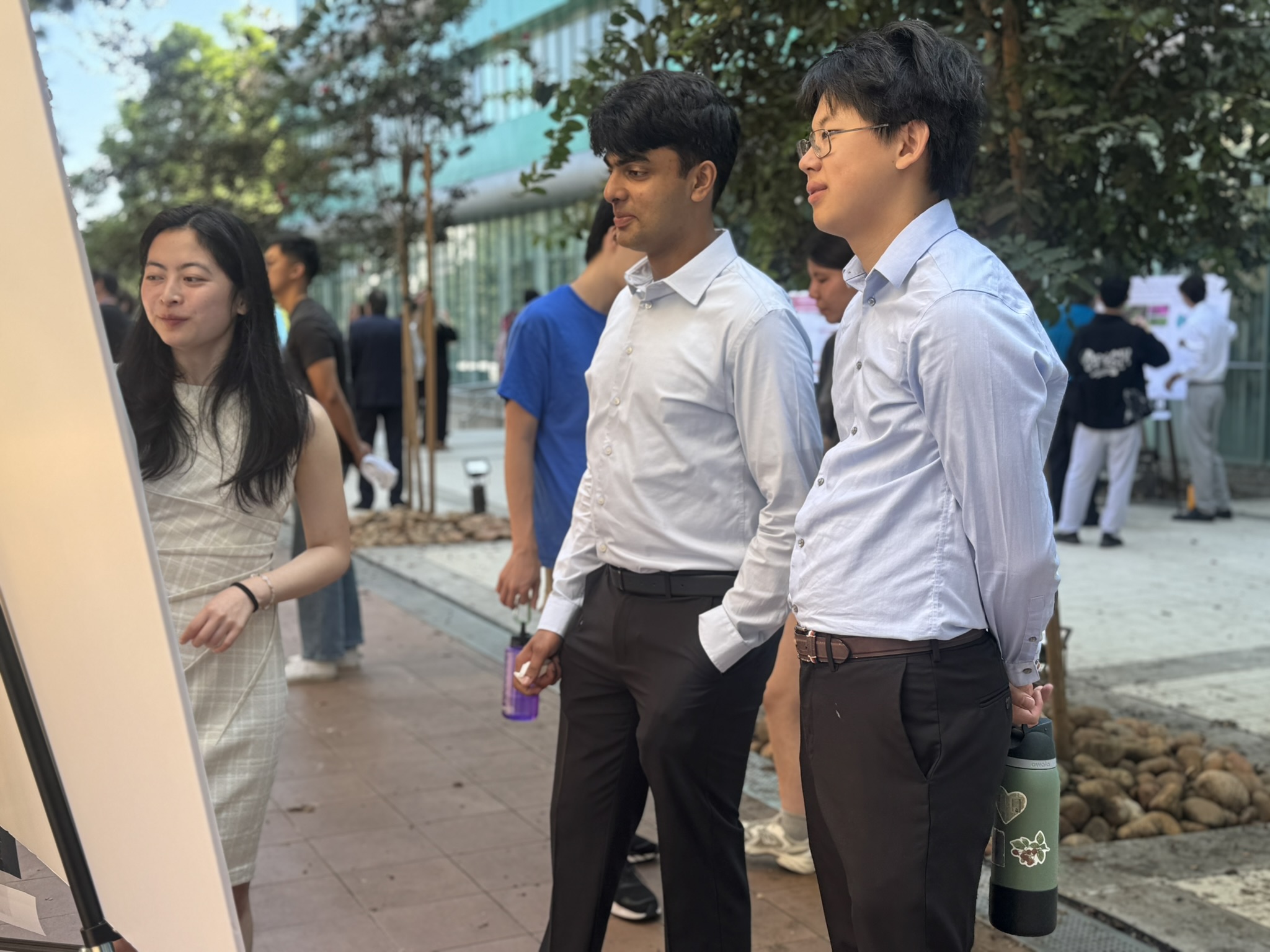 Scholars talking at the poster session